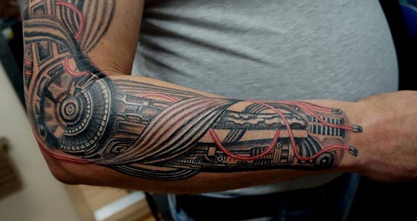 Mechanic arm tattoo